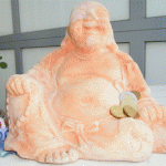 lachender Buddha mit Geld