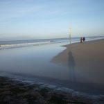 Strand mit Schatten der Fotografin